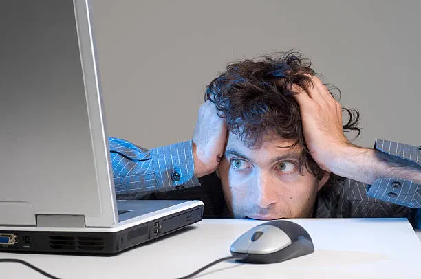 Image of a desperate programmer debugging code